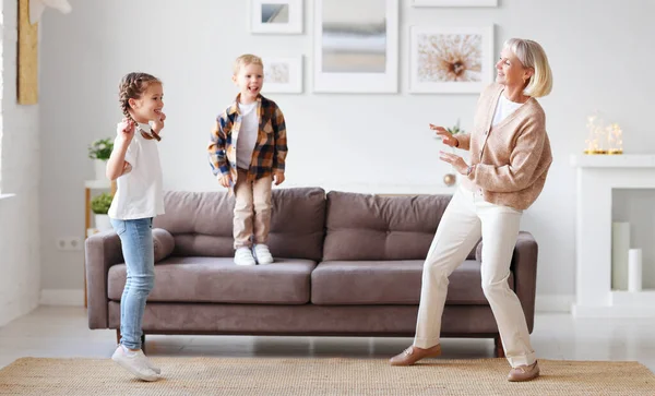 Delighted Mature Woman Dancing Cute Kids Living Room While Having — Stock Photo, Image