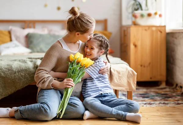 Happy Woman Bouquet Tulips Hand Embracing Kissing Cute Little Daughter — Stock Photo, Image