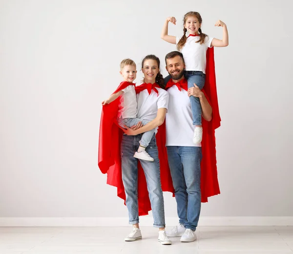 Cheerful Parents Kids Similar Clothes Red Superhero Capes Standing Together — Stock Photo, Image