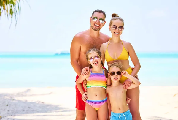 Laughing Parents Boy Girl Vivid Swimsuits Smiling Camera Standing Tropical — Stock Photo, Image