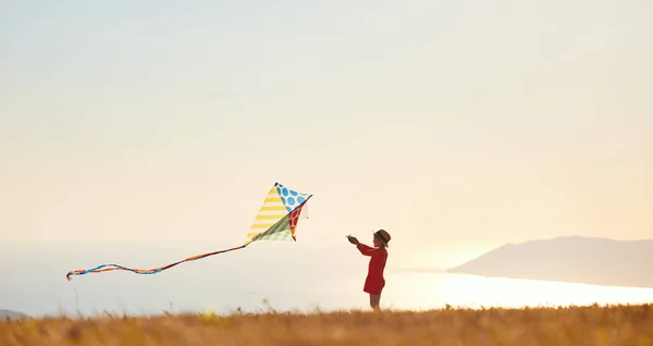 Happy Kid Girl Launches Kite Sunset Outdoors — Stockfoto