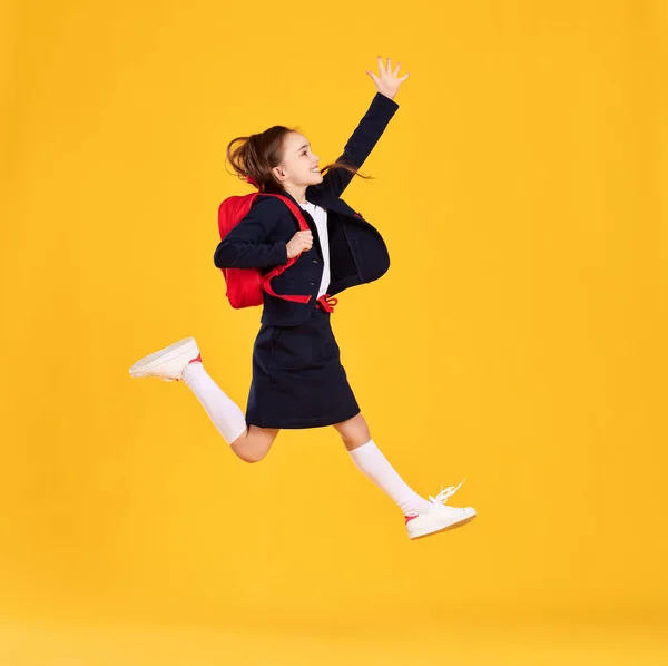 Full Body Side View Happy Preteen Schoolgirl Black Uniform Glasses — Stock Photo, Image