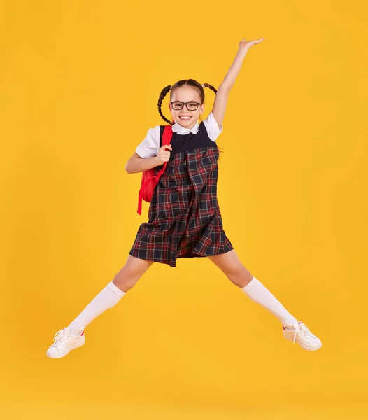 Full Body Happy Preteen Schoolgirl Black Uniform Glasses Backpack Jumping — Stock Photo, Image