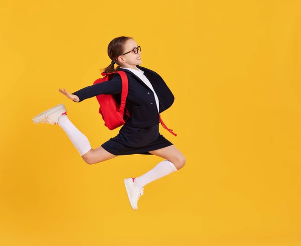 Full Body Happy Preteen Schoolgirl Black Uniform Glasses Backpack Jumping — Stock Photo, Image