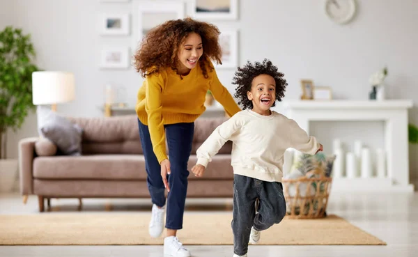 Playful African American Mother Trying Catch Excited Small Child Son — Stock Photo, Image