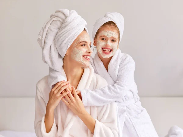 Cheerful Girl Bathrobe Towel Smiling Embracing Young Woman Moisturizing Mask — Stock Photo, Image