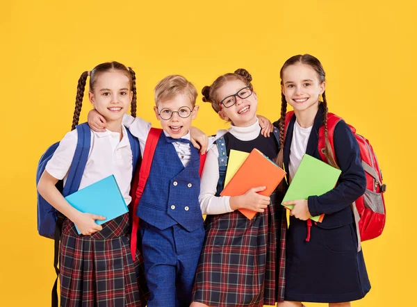 Optimistic Primary Classmates School Uniform Backpacks Looking Camera While Standing — Foto de Stock