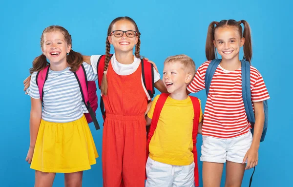 Optimistic Primary Classmates Casual Clothes Backpacks Looking Camera While Standing — ストック写真