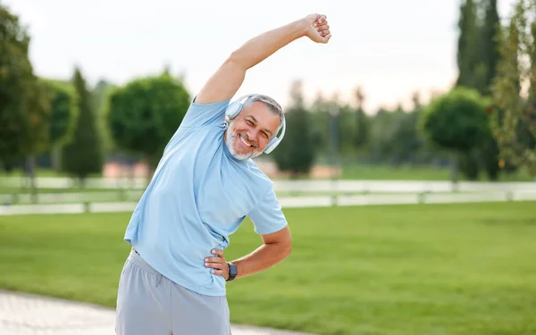 Staying Active Retirement Happy Joyful Mature Retired Sportsman Wearing Headphones — Stock Photo, Image