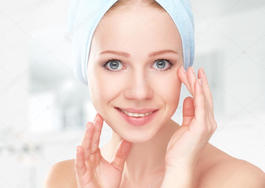 skin care. young beautiful healthy girl in towel in bathroom