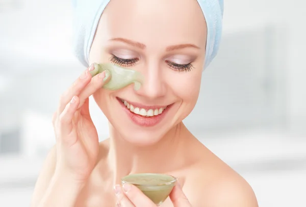 Beautiful girl in bathroom and mask for facial skin care — Stock Photo, Image