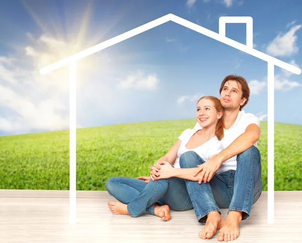 Concept:  housing and mortgage for young families. couple dreaming of  home — Stock Photo, Image