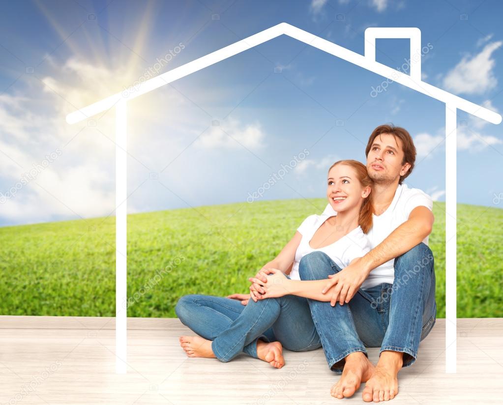 Concept:  housing and mortgage for young families. couple dreaming of  home