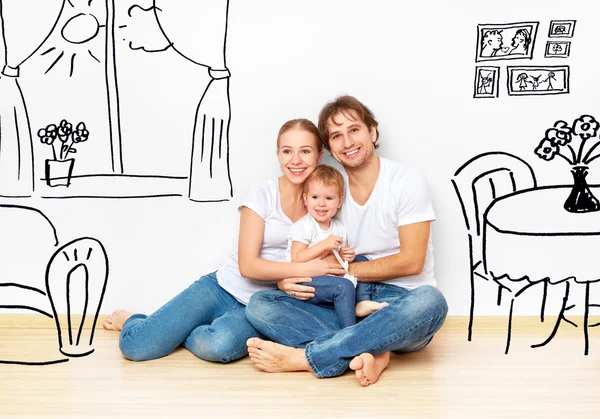 Concepto: familia joven feliz en el nuevo sueño apartamento y el interior del plan — Foto de Stock