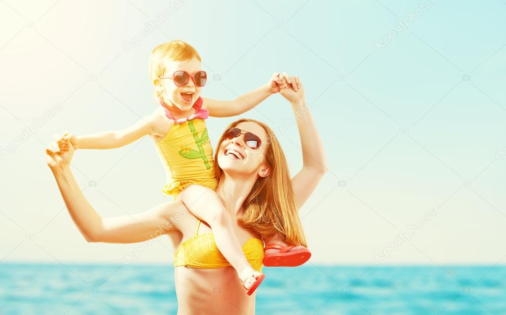 happy family on the beach. mother and baby daughter  