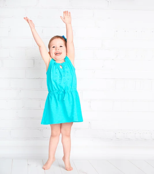 Happy little girl raised her hands up and measure your height — Stock Photo, Image