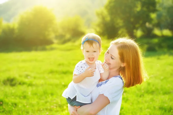Happy family on nature mother and baby daughter — Stock Photo, Image