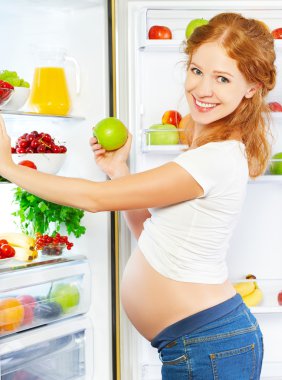 nutrition and diet during pregnancy. Pregnant woman with fruits  clipart