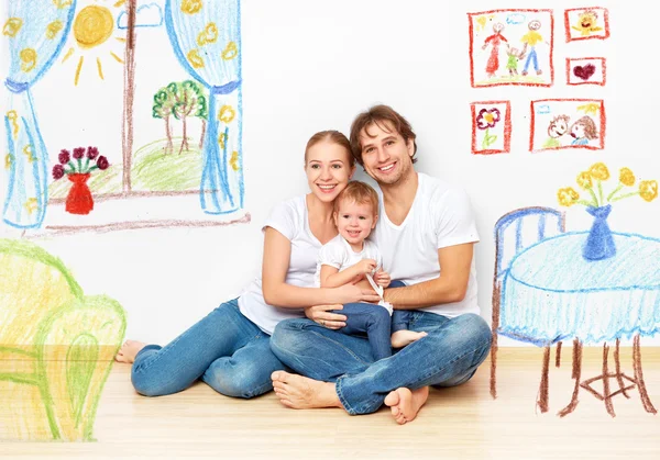 Conceito: família jovem feliz em novo apartamento sonho e plano em — Fotografia de Stock