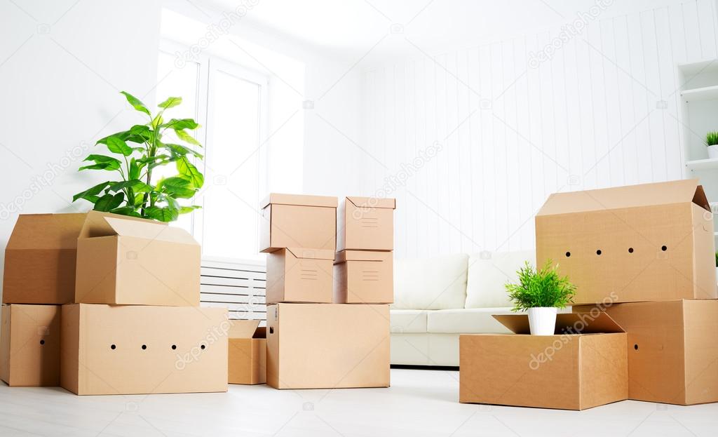 Move. lots of cardboard boxes in empty new apartment — Stock Photo