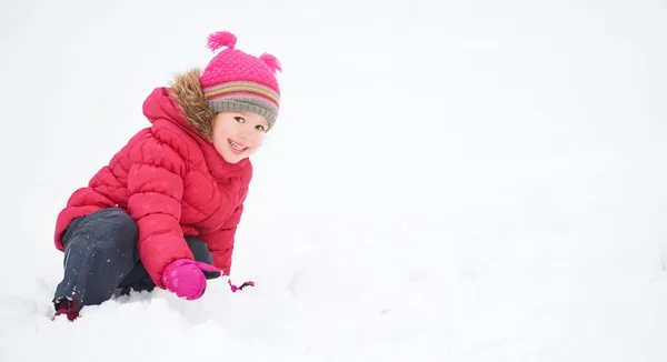 Happy child girl on a winter walk. — Stock Photo, Image