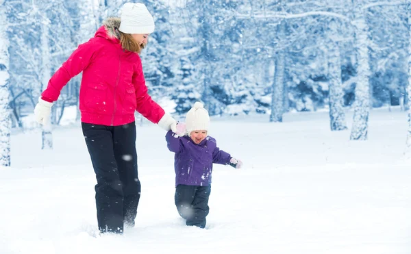 Happy family mother and baby girl daughter run, walk and playing — Stock Photo, Image