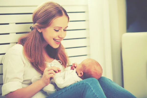 Happy family. mother plays with newborn baby — Stock Photo, Image