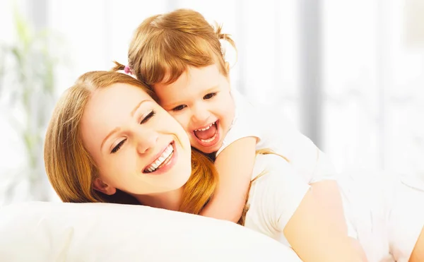 Happy family mother and child daughter playing and laughing bab — Stock Photo, Image