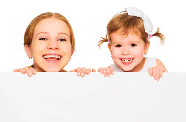 Happy family mother child daughter with blank white poster — Stock Photo, Image