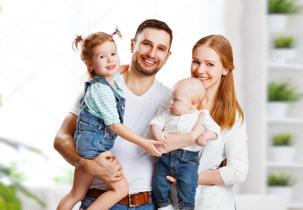 happy family mother, father and children at home