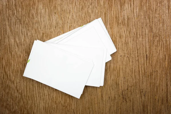 white blank visit cards on wood table