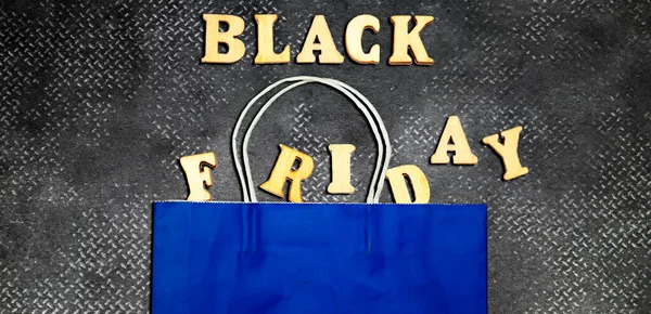 Forming Black Friday Wooden Alphabets Blue Shopping Bag — Stock Photo, Image