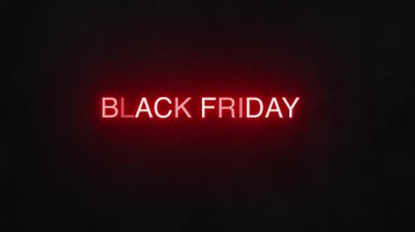 Siyah arka planda parlayan Kara Cuma tabelası