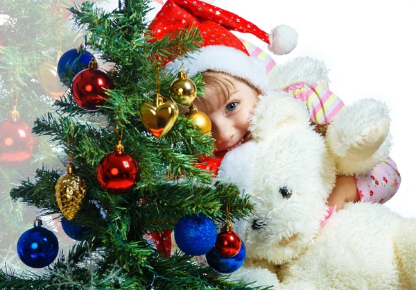 Ritratto di una bambina vestita con un cappello di Babbo Natale su un retro — Foto Stock
