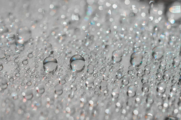 Macro photography of water drops on a mirror reflective surface. — Stock Photo, Image