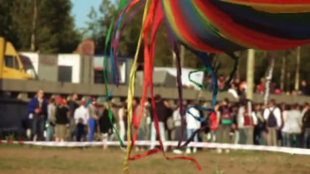 Floating multi-colored parachute — Stock Video