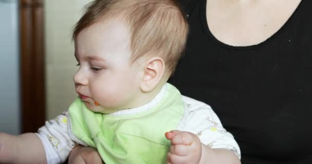 Baby boy eating a Karotka — Stock video
