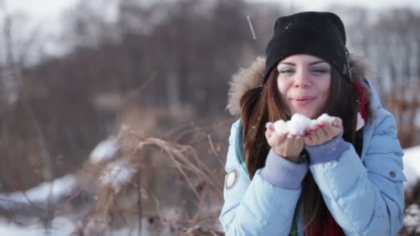 Girl playing with snow — Stock Video