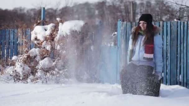 Girl playing with snow — Stock Video