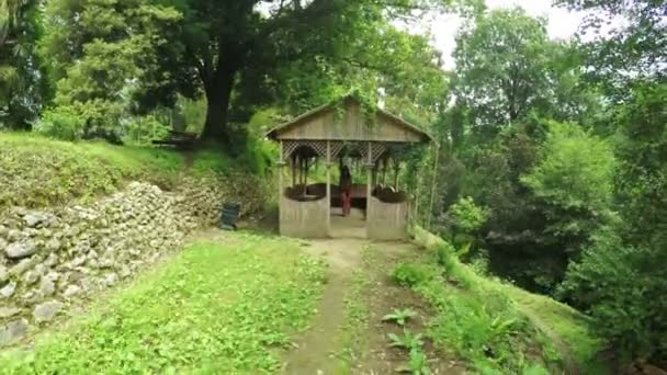 Girl in wooden gazebo — Stock Video