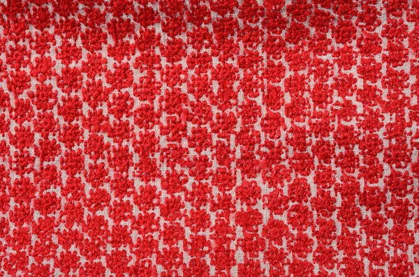 家庭用の織物の背景を持つ赤い糸のキャンバスで刺繍された家 — ストック写真