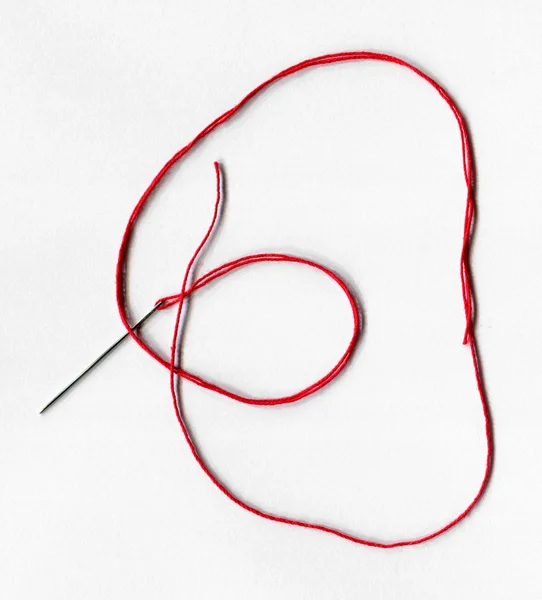 Primer plano de la aguja de coser con hilo —  Fotos de Stock