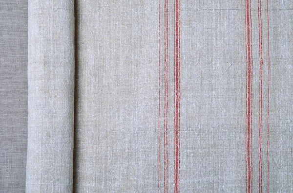 Szczelnie-do góry tkaniny samodział konopi z czerwonym paskiem — Zdjęcie stockowe