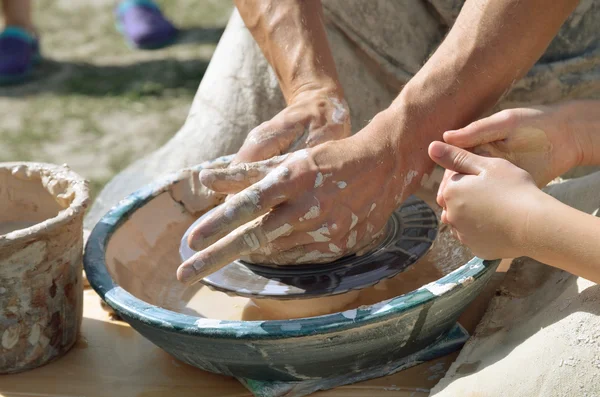 Potters working by the throwing wheel — Stock Photo, Image