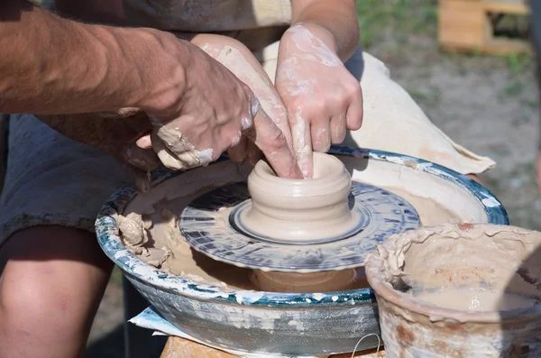 Potters working by the throwing wheel — Stock Photo, Image