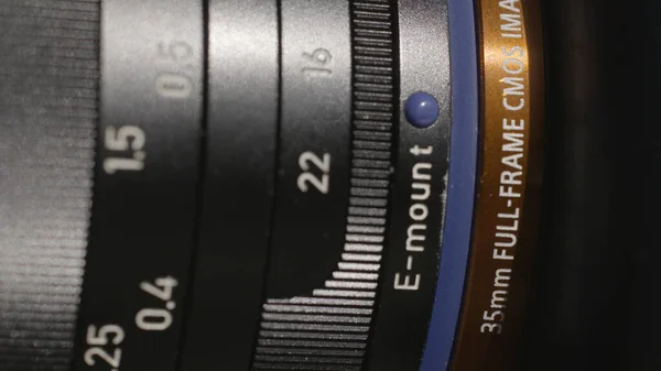 Close-up of photo lens details. Action. Macro photography of photo lens with detailed values on rings. Professional modern camera lens in detail — Stock Photo, Image