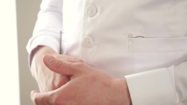 Man pulling out vintage glasses. Stock footage. Close-up of man in white shirt pulling glasses out of his pocket. Aristocratic man pulls out 19th century glasses — Stock Video