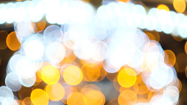 Defocused blinking lights background, winter holidays. Concept. Close up of blurred Christmas tree lights twinkling