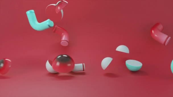 Abstracte kleurrijke objecten vallen geïsoleerd neer op koraalachtergrond. Animatie. 3D bagel vormige details en halve bollen vallen willekeurig. — Stockvideo