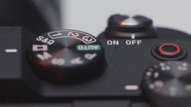 Close up of DSLR camera buttons and dials. Action. Details of a new professional camera on white background. — Stockvideo